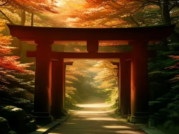 A vermilion torii gate over a forest path in autumn light